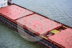 Close up industrial river barge on water