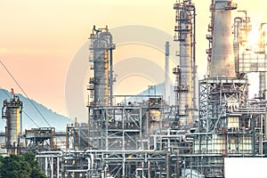 Close up Industrial view at oil refinery plant form industry zone with sunrise and cloudy sky