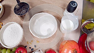 Close-up of ingredients for making Easter cake and decorated eggs on a canvas. Preparing for the Easter holiday.