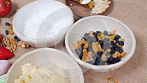 Close-up of ingredients for making Easter cake and decorated eggs on a canvas. Preparing for the Easter holiday.