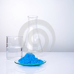 Close up inorganic chemical on white laboratory table. CopperII sulfate, alcohol. Chemical ingredient for Cosmetics and