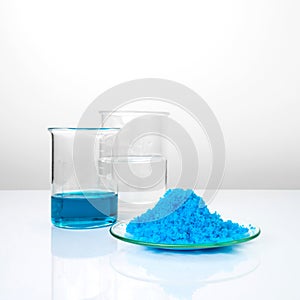 Close up inorganic chemical on white laboratory table. CopperII sulfate,  alcohol. Chemical ingredient for Cosmetics and