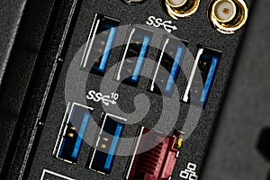 Close up of input output panel in the back of a computer with USB 3.0 ports