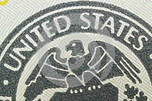 close-up - the inscription United States and the eagle on the banknote of one hundred US dollars.