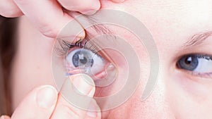 Close up of inserting a contact lens