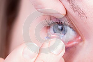 Close up of inserting a contact lens