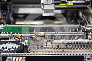 Close up inside automatic PCB LED SMT pick and place machine of high technology and accuracy for assembly or manufacturing