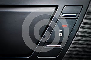 Close up inside car door lock button