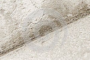 Close up of an inside corner with lime-cement plaster mix. Monochromatic image. Construction industry background texture