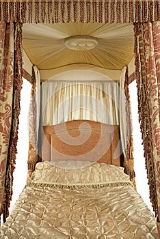 Close up inside a four poster bed