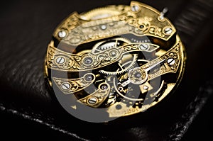 Close up inside mechanical vintage watch. Handmade engraving. Concept eternity, teamwork. Soft focus. Free space for text. Macro.