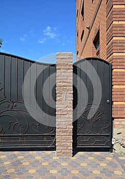 Close up on Installation of Entrance Metal Fence Door and Gate for Car