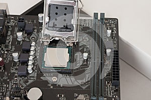 Close up of installed CPU processor on modern, new, motherboard