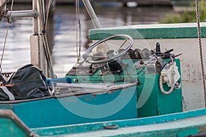 Close up of interior of shrimping boat docked on shore of bayou