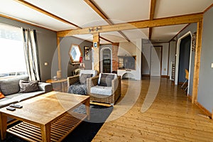 Close up interior view of big room of private house with open fireplace   in typical scandinavian hous
