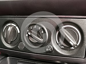 Close up interior view of the car aircond button controller.