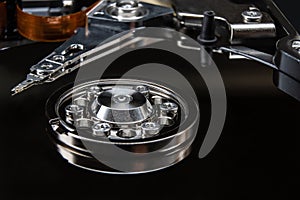 Close-up of the internals of a hard drive. Rotating hard disk platters and data read head