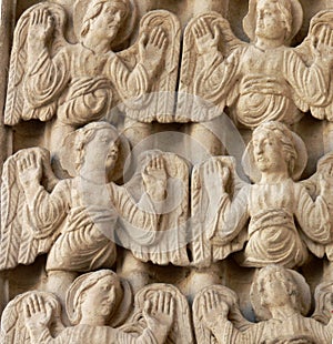 Close up of intricate carvings of Angels on Arles cathedral, France