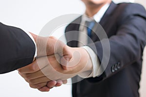 Close up investor businessman handshake with partner vendor. Businessman shaking hands Using as business success concept,