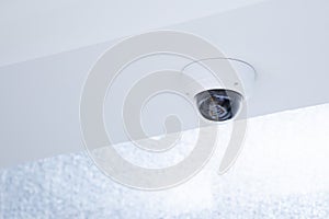 Close-up IP surveillance camera on the ceiling for office security system or home alert and prevent