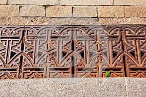 Close-up iron grate drainage system for draining rainwater in Slovakia