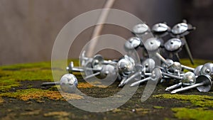 Close up of iron nails on the table, outdoors
