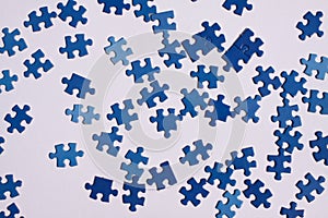 Close up of isolated blue puzzle pieces, white background