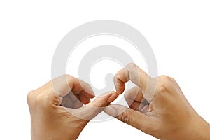 Close up isolated hand of Asian woman picking dirty nails on white background have copy space for put text. Concept unhealthy