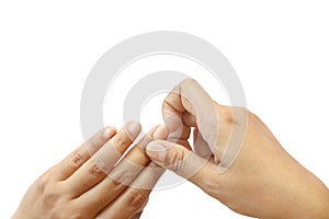 Close up isolated hand of Asian woman picking dirty nails on white background have copy space for put text. Concept unhealthy