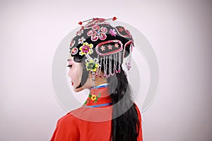 Close-up isolated white background Beijing opera Chinese female actress woman makeup comb hair with traditional headwear costume
