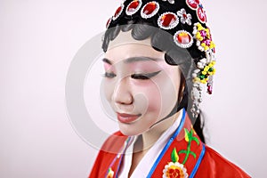 Close-up isolated white background Beijing opera Chinese female actress woman makeup comb hair with traditional headwear costume
