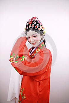 Close-up isolated white background Beijing opera Chinese female actress woman makeup comb hair traditional headwear costume drama