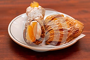 Close up of italian dessert cannoli on plate