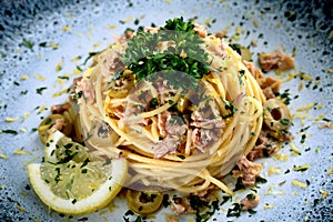 Close up Italian pasta with tuna fish olive and lemon photo