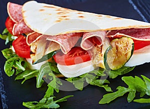 Close-up of italian sandwich wraps or piadina