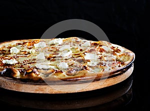 Close up italy hot pizza with cheese isolated on black background