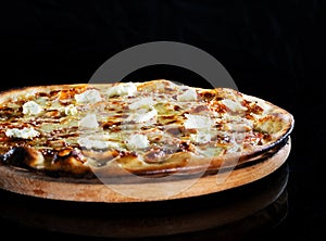 Close up italy hot pizza with cheese isolated on black background