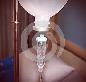 Close up IV saline solution drip for patient in hospital blur vintage