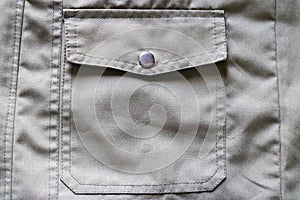 Close Up Of Jacket Buttons And Pockets.