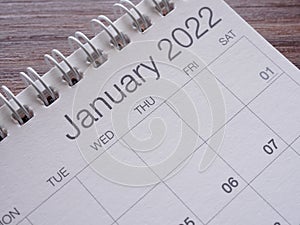 Close up, January calendar 2022 page on wooden table