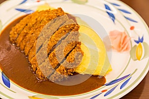 Japanese curry omurice with deep fired pork cutlet photo