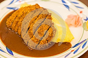 Japanese curry omurice with deep fired pork cutlet photo