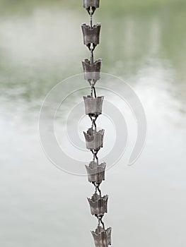 Close-up of Japanese rain chain.