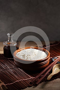 Close up Japanese rice in measuring cup on table