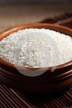 Close up Japanese rice in measuring cup on table