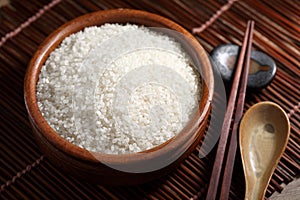 Close up Japanese rice in measuring cup on table