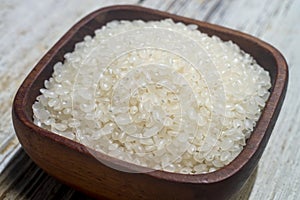 Close up of japanese rice in a wooden cup.