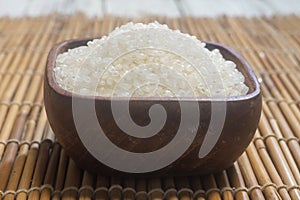 Close up of japanese rice in a wooden cup.