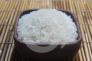 Close up of japanese rice in a wooden cup.