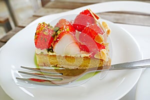Close up japanese strawberry tart on white plate background.